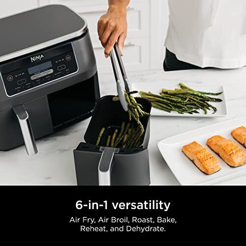 Check Out dual-zone technology https://articleblogging.com/wp-content/uploads/2023/08/Ninja-DZ201-Foodi-Air-Fryer-air-fryer-kitchen-appliance-dual-zone-technology-adjustable-settings-large-capacity-versatile-cooking-functions-Product-Review-86d5bbd4.jpg